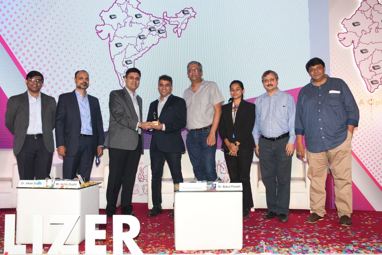 Aleem Merchant at an award ceremony